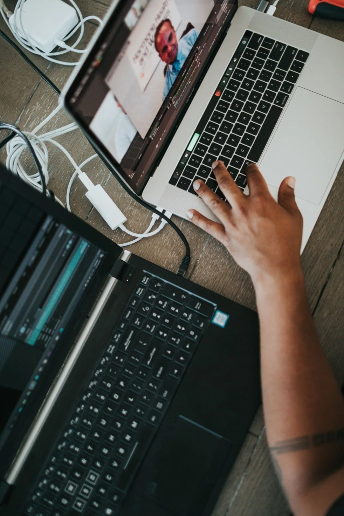 a person using a laptop computer on a table